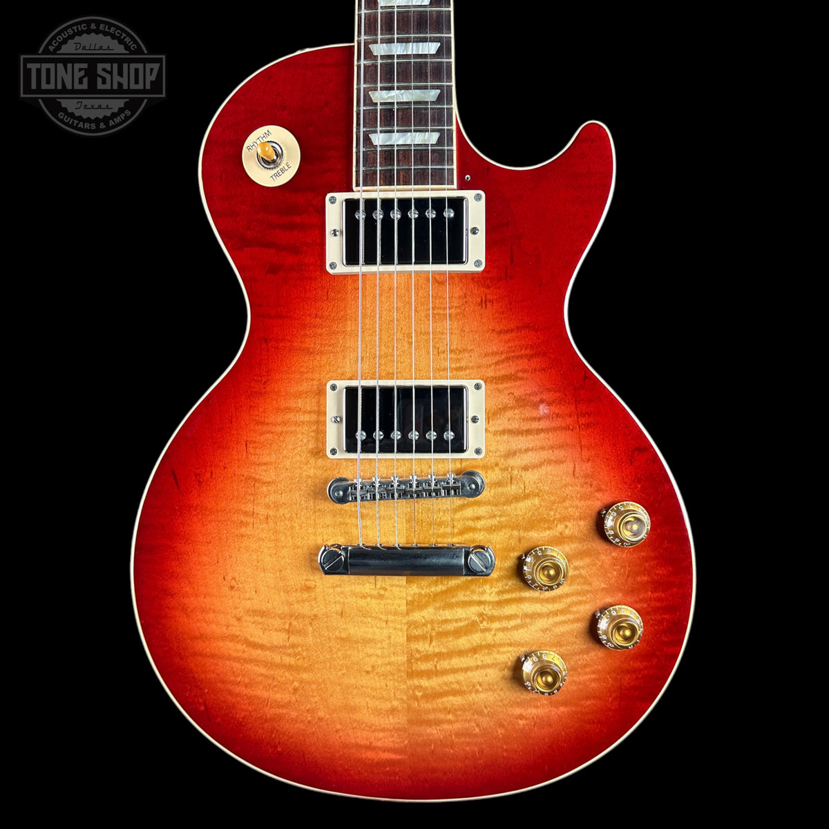 Electric guitar with a sunburst finish on a black background, featuring the Tone Shop logo.