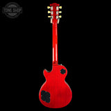 Red electric guitar headstock on a black background with 'Tone Shop' logo.