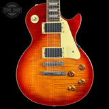 Electric guitar with a sunburst finish on a black background, featuring the Tone Shop logo.