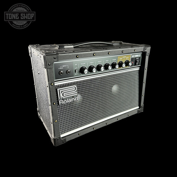 Roland guitar amplifier on a black background with 'Tone Shop' logo.