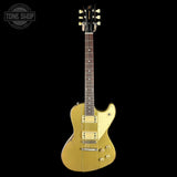 Gold electric guitar on a black background with 'Tone Shop' logo.