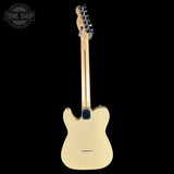 A natural wood Fender Telecaster electric guitar shown from the back, featuring a single cutaway body, six-string tuning system, and black hardware, set against a solid black background with a Tone Shop watermark in the top-left corner.