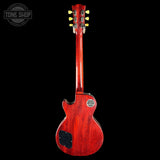 Red electric guitar on a black background with 'Tone Shop' logo.