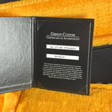 Gibson Custom Certificate of Authenticity on a textured surface
