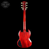 Red electric guitar on a black background with 'Tone Shop' logo.
