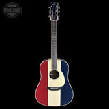 Acoustic guitar with a red, white, and blue design on a black background