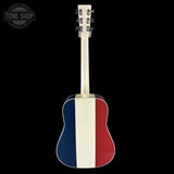 Acoustic guitar with a red, white, and blue design on a black background