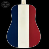 Acoustic guitar with a design featuring blue, white, and red stripes on a black background.