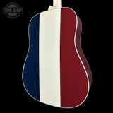 Acoustic guitar with a design featuring blue, white, and red stripes on a black background.