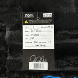 PRS guitar label with model details on a textured black background