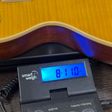 Used Epiphone Kirk Hammett "Greeny" 1959 Les Paul Standard on scale displaying weight.