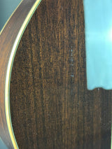 Close-up of a wooden surface with a visible scratch.