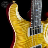 Close-up of a electric guitar with a sunburst finish on a black background