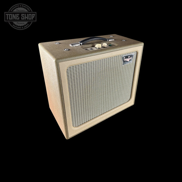 A vintage-style guitar amplifier speaker cabinet with a beige/tan textured grille and front baffle, shown at an angle on a solid black background. A Tone Shop watermark is visible in the top-left corner.