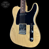 A classic Fender Telecaster-style electric guitar with a natural maple wood finish, black pickguard, and chrome hardware, shown against a solid black background with a Tone Shop watermark in the top left corner.