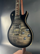 Close-up of a electric guitar with a focus on the body and neck.