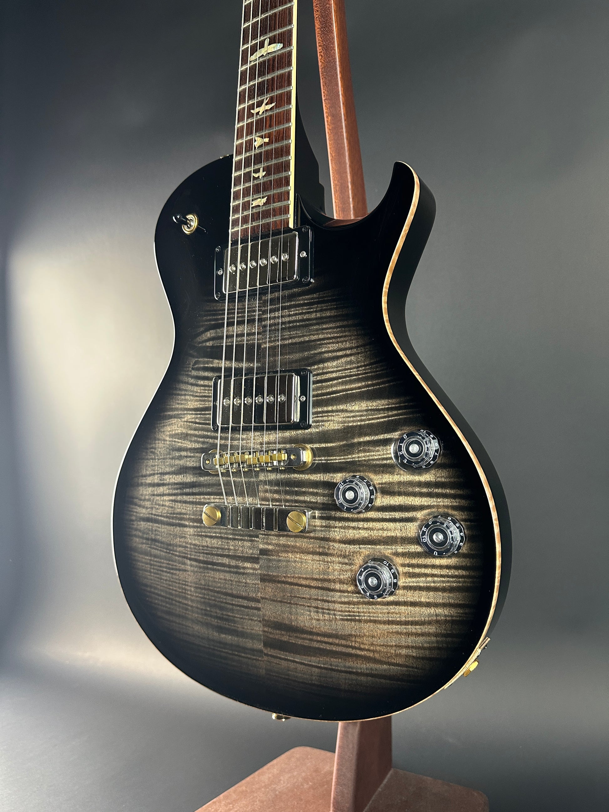 Close-up of a electric guitar with a focus on the body and neck.