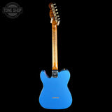 A blue electric guitar shown from the back against a solid black background, with a Tone Shop watermark in the upper left corner.