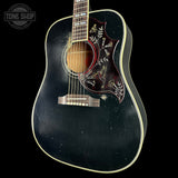 Acoustic guitar with decorative inlay on a black background, featuring the Tone Shop logo.
