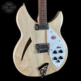 Electric guitar with a visible brand logo on a black background