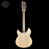 Back view of a guitar with a 'Tone Shop' logo in the corner.