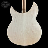 Back view of a guitar body with 'Tone Shop' logo in the corner.