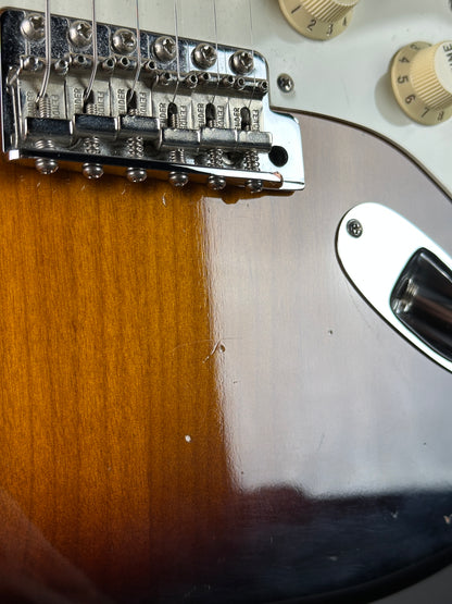 Close-up of a guitar's bridge and part of the body