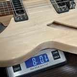 Digital scale displaying weight on a guitar