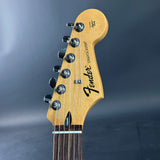 Fender Stratocaster guitar headstock on a dark gray background