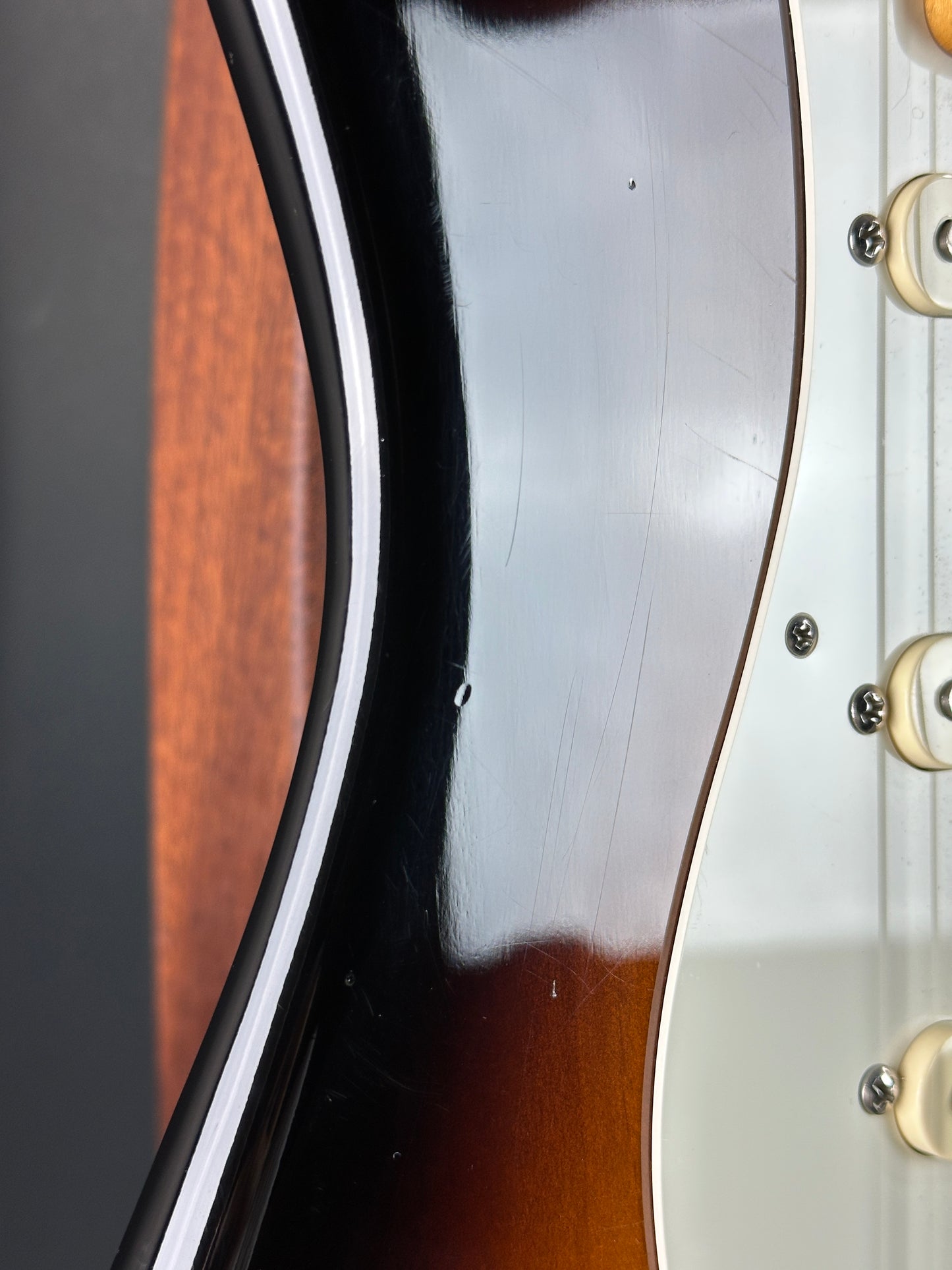 Wear on body of Used Fender Eric Johnson Strat 2-Color Sunburst.