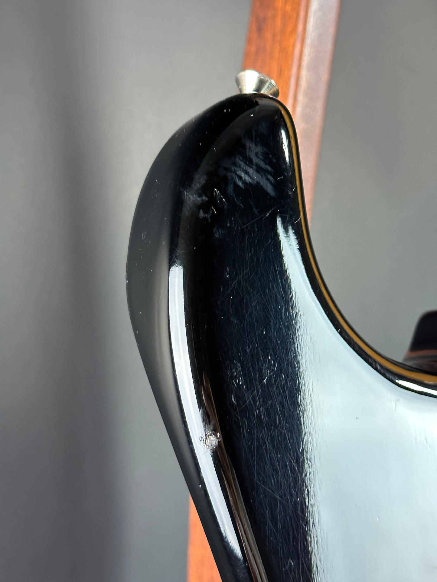 Wear on horn of Used Fender Eric Johnson Strat 2-Color Sunburst.