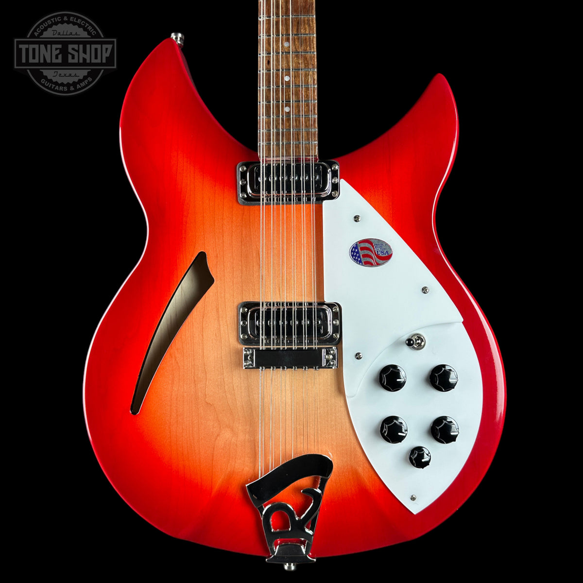 Electric guitar with a red and white design on a black background, featuring the Tone Shop logo.