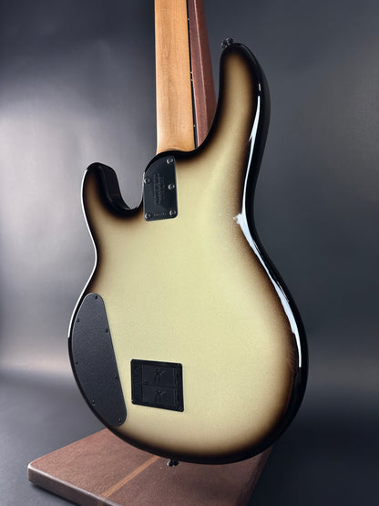 Close-up of a bass guitar on a dark background