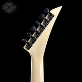 Beige electric guitar neck with black tuning pegs on a black background, featuring 'Tone Shop' logo.