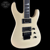 White electric guitar with a black pickguard on a white background