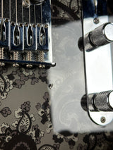 Ding below bridge of Used Fender FSR Black Paisley Tele.
