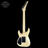 Electric guitar with a blonde finish on a black background, featuring the Tone Shop logo.