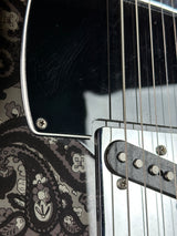 Finish crack near bridge of Used Fender FSR Black Paisley Tele.