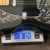 Used Fender FSR Black Paisley Tele on scale displaying weight.