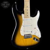 Electric guitar with a sunburst finish on a black background, featuring the Tone Shop logo.