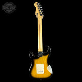Electric guitar with a sunburst finish on a black background, featuring the Tone Shop logo.