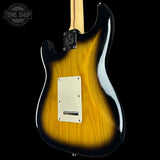 Electric guitar with a sunburst finish on a black background, featuring the Tone Shop logo.