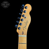 Fender headstock of a guitar with a black background