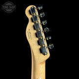 Guitar headstock with tuning pegs on a black background, featuring 'Tone Shop' logo.