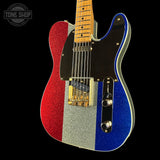 Electric guitar with red, silver, and blue body on a black background