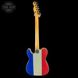 Guitar with a design resembling the French flag on a black background, featuring the Tone Shop logo.