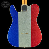 Guitar with blue, silver, and red glitter finish on a black background