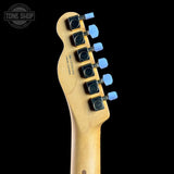 Guitar headstock with tuning pegs on a black background, featuring the Tone Shop logo.