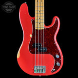 Red electric bass guitar with a black background, featuring the Tone Shop logo.