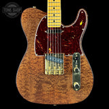 Electric guitar with a marbled finish on a black background, featuring the Tone Shop logo.